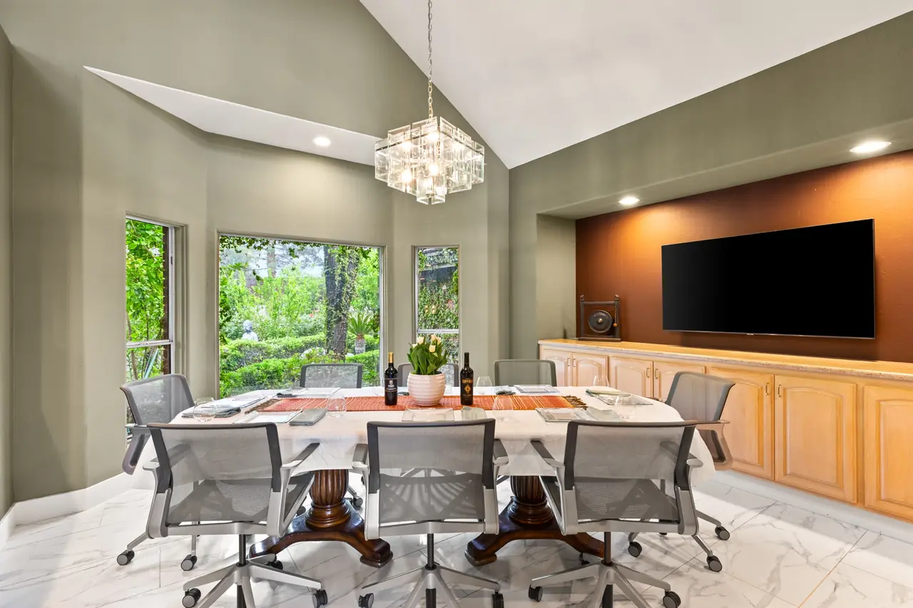 Dining area with chandelier and garden windows