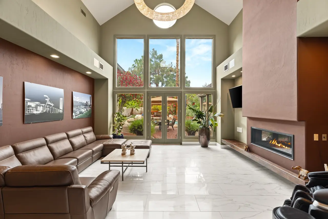 Formal living room with floor-to-ceiling windows and a six-foot chandelier