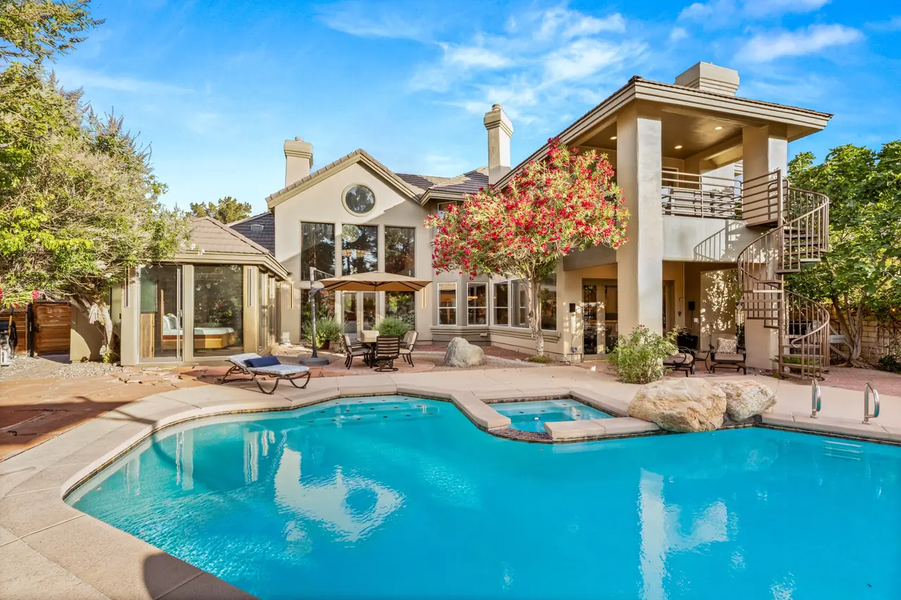 Pool, spa and rear elevation in daylight