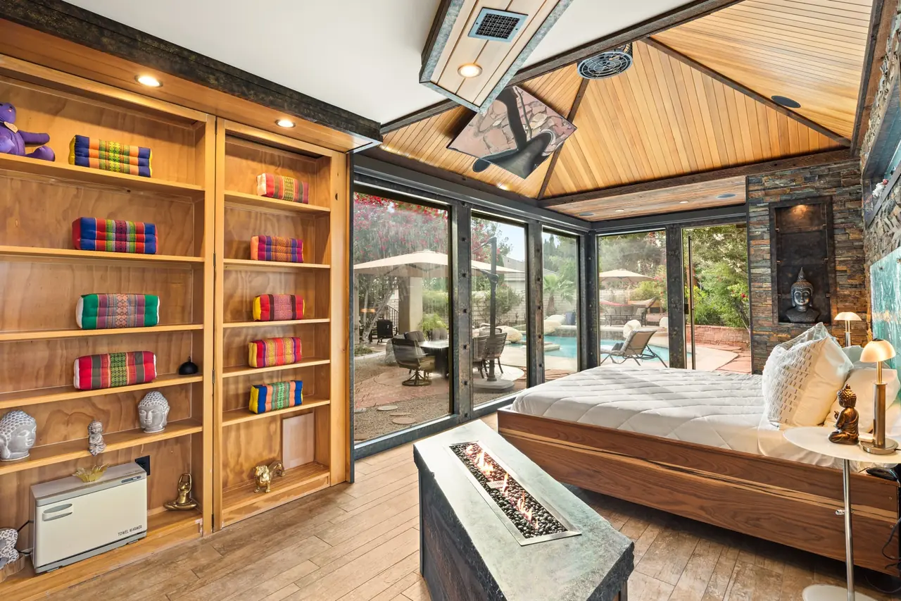 Primary bedroom with skylight and garden view